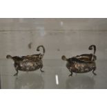 Two similar silver sauce boats.