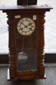 A Vienna style walnut cased wall clock.