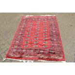 A good large Persian design carpet, pink ground with all-over floral decoration 385cm x 290cm.