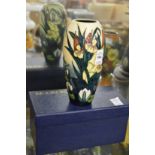 A Moorcroft vase decorated with bull rushes with original box.
