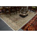 A Persian design carpet, cream ground with stylised floral decoration 250cm x 196cm.