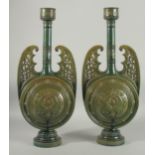 A PAIR OF 19TH CENTURY GREEN HISPANO-MORESQUE GLAZED CERAMIC CANDLESTICKS / VASES, 60cm high.