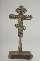 A FINE 18TH CENTURY OTTOMAN ARMINIAN OR BALKANS ENAMELLED CROSS on a later wooden stand, cross