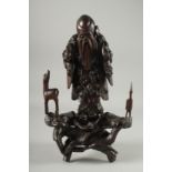 A CHINESE SECTIONAL ROOT WOOD CARVING OF SHOU LAO, 41cm high overall.