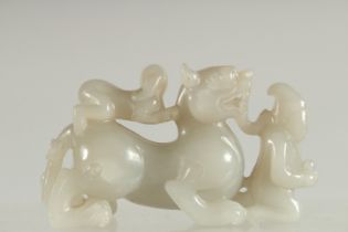 A CHINESE CARVED JADE KYLIN PAPERWEIGHT, 12cm long.