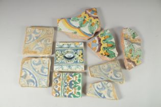 NINE 17TH CENTURY GLAZED POTTERY POLYCHROME TILE FRAGMENTS, various sizes, (9).