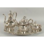 A FINE CHINESE EXPORT SILVER TEA SET AND TRAY, comprising teapot, water pot, milk jug, sugar bowl,