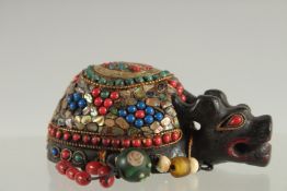 A TIBETAN ABALONE INLAID FIGURE OF A TORTOISE, inset with various other beads, 9cm long.