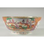 A CHINESE EXPORT FAMILLE ROSE MANDARIN PATTERN PORCELAIN PUNCH BOWL, the exterior painted with two