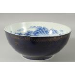 A LARGE CHINESE BLUE AND WHITE PORCELAIN BOWL, the interior painted with a continuous mountainous