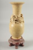 A CHINESE SOAPSTONE VASE, carved with relief dragon, 30cm high.