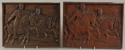 A PAIR OF OTTOMAN CARVED WOOD PLAQUES, 27cm x 35cm.