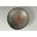 A 18TH CENTURY PERSIAN TINNED COPPER MAGIC BOWL, 18.5cm diameter.