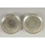 TWO CHINESE COIN DISHES, 9cm diameter.