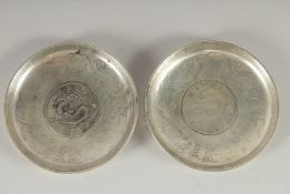 TWO CHINESE COIN DISHES, 9cm diameter.