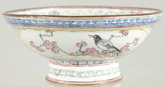 A 19TH CENTURY CHINESE CANTON ENAMEL BOWL, painted with panels of birds and native flora, 13cm