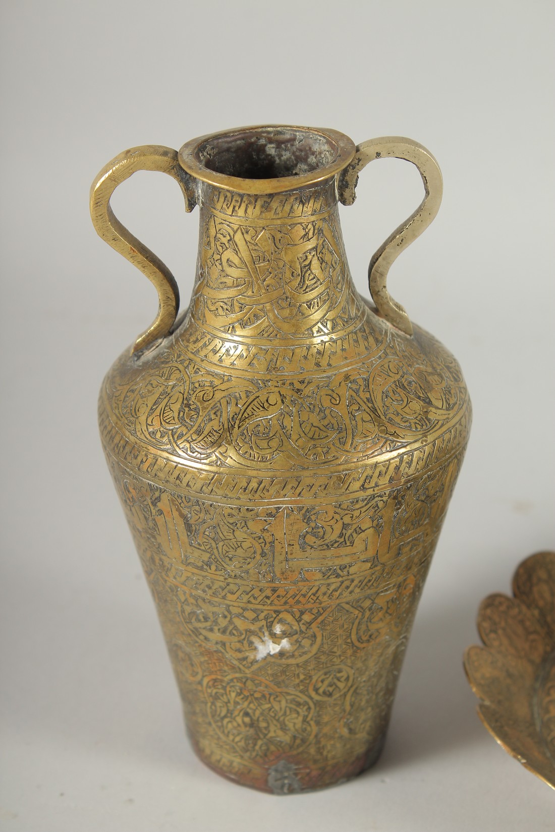 THREE 19TH CENTURY IRANIAN ENGRAVED BRASS PIECES; comprising a twin handle vase / vessel with - Image 7 of 8