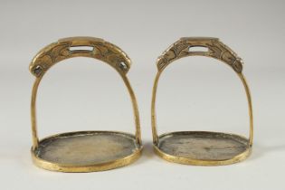 A PAIR OF CHINESE GILT BRONZE STIRRUPS.