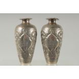 A PAIR OF EARLY 20TH CENTURY SIGNED PERSIAN SILVER VASES, with fine engraved decoration, each