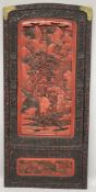 A LARGE 19TH CENTURY CHINESE CARVED BLACK AND RED CINNABAR LACQUER PANEL, depicting two male figures