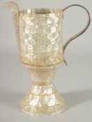 AN INDIAN GOA MOTHER OF PEARL JUG, 26.5cm high.