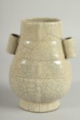 A CHINESE CRACKLE GLAZE TWIN HANDLE VASE, 18.5cm high.