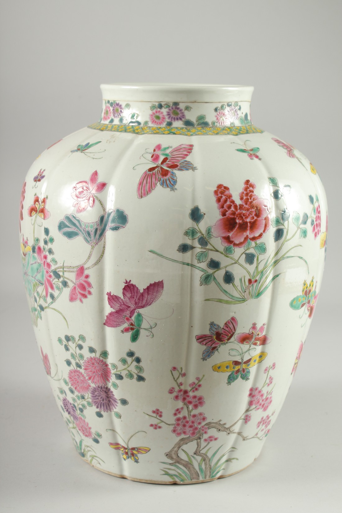 A LARGE CHINESE FAMILLE ROSE PORCELAIN VASE, painted with flora and butterflies, 34cm high. - Image 2 of 6