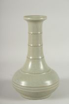 A CHINESE CELADON GLAZE BOTTLE VASE, 22.5cm high.