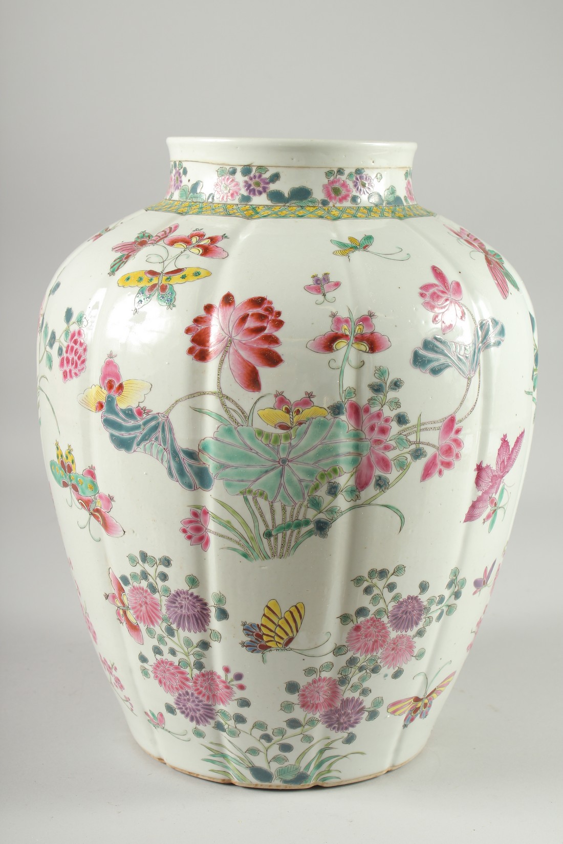 A LARGE CHINESE FAMILLE ROSE PORCELAIN VASE, painted with flora and butterflies, 34cm high. - Image 4 of 6