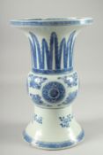 A LARGE CHINESE BLUE AND WHITE PORCELAIN GU SHAPE VASE, decorated with floral motifs, (repair to