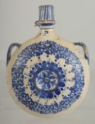 A 19TH CENTURY MOROCCAN POTTERY PILGRIM WATER FLASK, 21.5cm high.