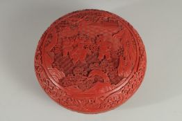 A CHINESE CINNABAR LACQUER CIRCULAR BOX AND COVER, the lid with panel depicting boys playing in a