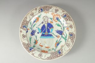 AN OTTOMAN TURKISH IZNIK GLAZED POTTERY PLATE, 31cm diameter.