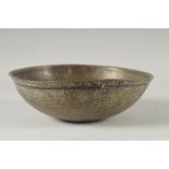 AN 18TH CENTURY PERSIAN ENGRAVED CALLIGRAPHIC BRASS BOWL 19cm wide.