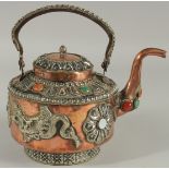 A SRI LANKAN COPPERED METAL EWER, with mounted dragons and stones.