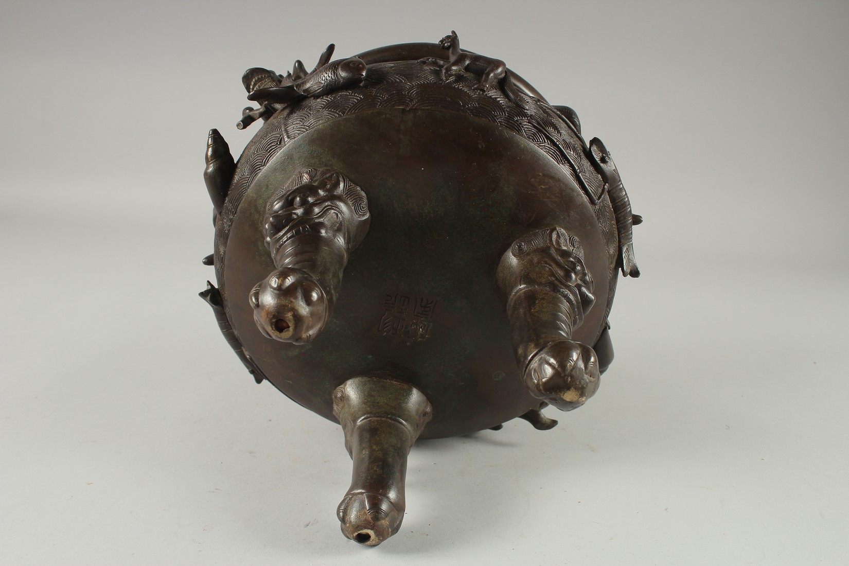 A LARGE CHINESE BRONZE TWIN HANDLE TRIPOD CENSER, with relief horses and sea creatures, the - Image 6 of 7