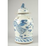 A LARGE CHINESE BLUE AND WHITE PORCELAIN DRAGON JAR AND COVER, 47cm high.