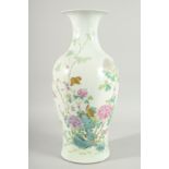 A CHINESE QING DYNASTY FAMILLE ROSE PORCELAN BALUSTER VASE, painted with birds and native flora,