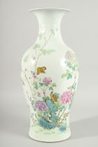 A CHINESE QING DYNASTY FAMILLE ROSE PORCELAN BALUSTER VASE, painted with birds and native flora,