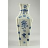 A LARGE BLUE AND WHITE PORCELAIN VASE, decorated with objects and various symbols, the neck with