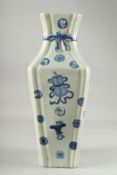 A LARGE BLUE AND WHITE PORCELAIN VASE, decorated with objects and various symbols, the neck with