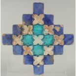 A FINE 18TH-19TH CENTURY INDIAN MULTAN GLAZED POTTERY TILE, with raised geometric design, 23cm x