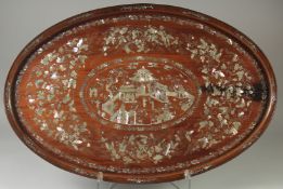 A VERY FINE CHINESE MOTHER OF PEARL INLAID HARDWOOD OVAL TRAY, beautifully decorated with central