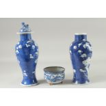 A PAIR OF CHINESE BLUE AND WHITE PORCELAIN PRUNUS JARS, (one lacking cover, af), together with a