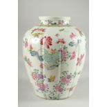 A LARGE CHINESE FAMILLE ROSE PORCELAIN VASE, painted with flora and butterflies, 34cm high.