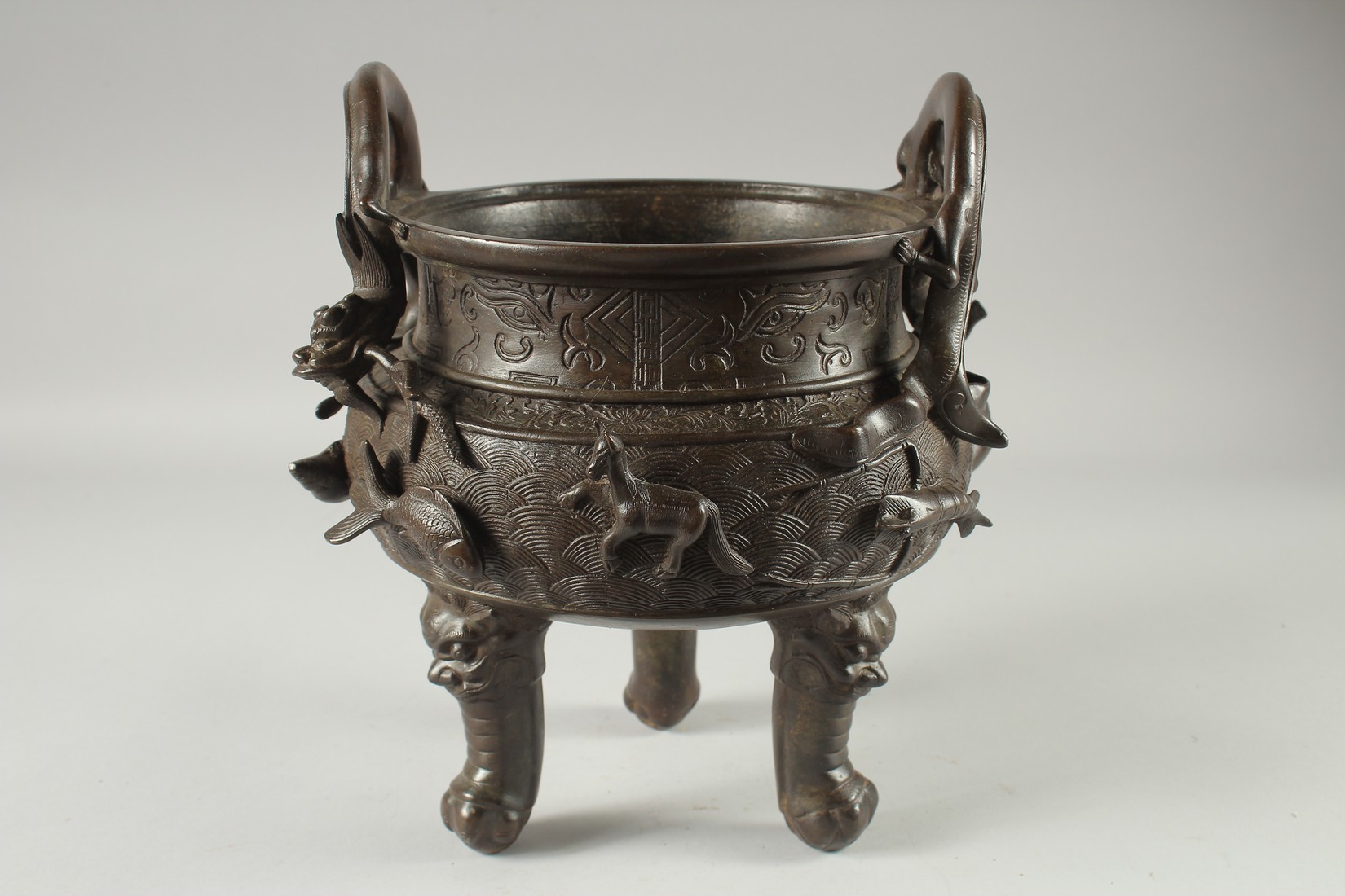 A LARGE CHINESE BRONZE TWIN HANDLE TRIPOD CENSER, with relief horses and sea creatures, the - Image 3 of 7