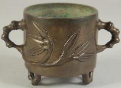 AN 18TH-19TH CENTURY CHINESE BAMBOO DESIGN BRONZE CENSER, with bamboo-form twin handles and raised