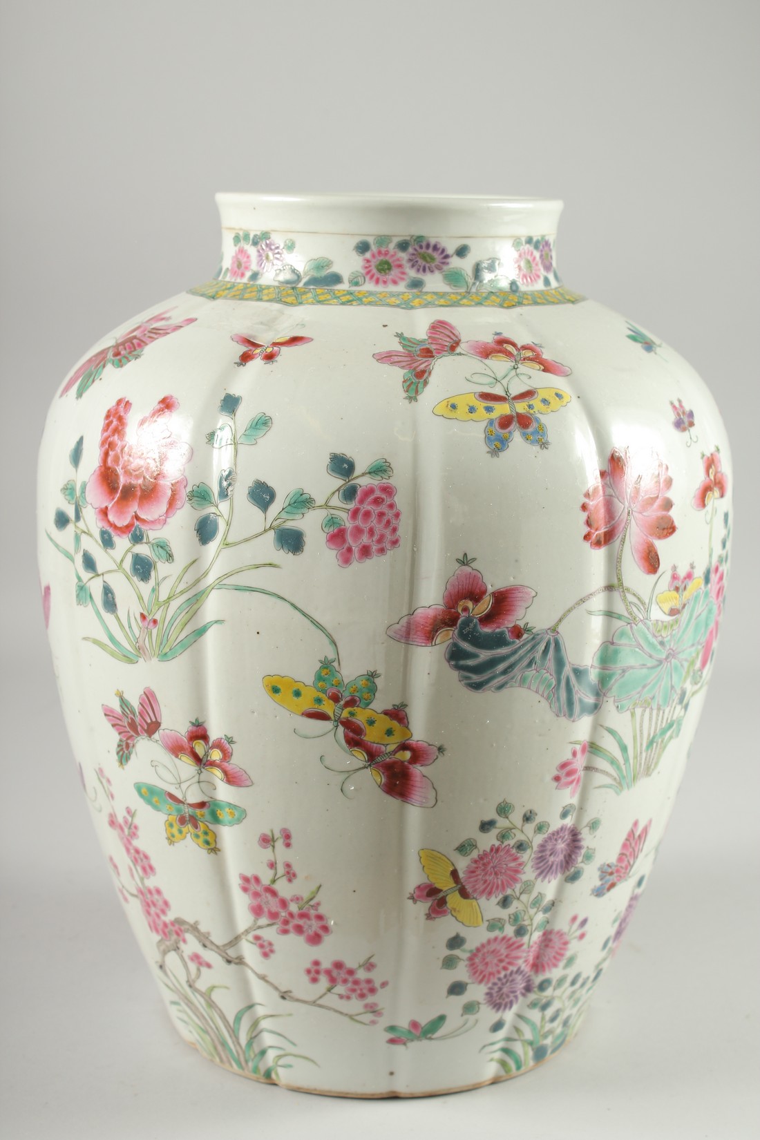 A LARGE CHINESE FAMILLE ROSE PORCELAIN VASE, painted with flora and butterflies, 34cm high. - Image 3 of 6