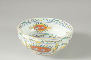 A TURKISH KUTAHYA GLAZED POTTERY BOWL, 19cm diameter.