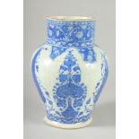 AN OTTOMAN TURKISH BLUE AND WHITE GLAZED POTTERY VASE, 29cm high.